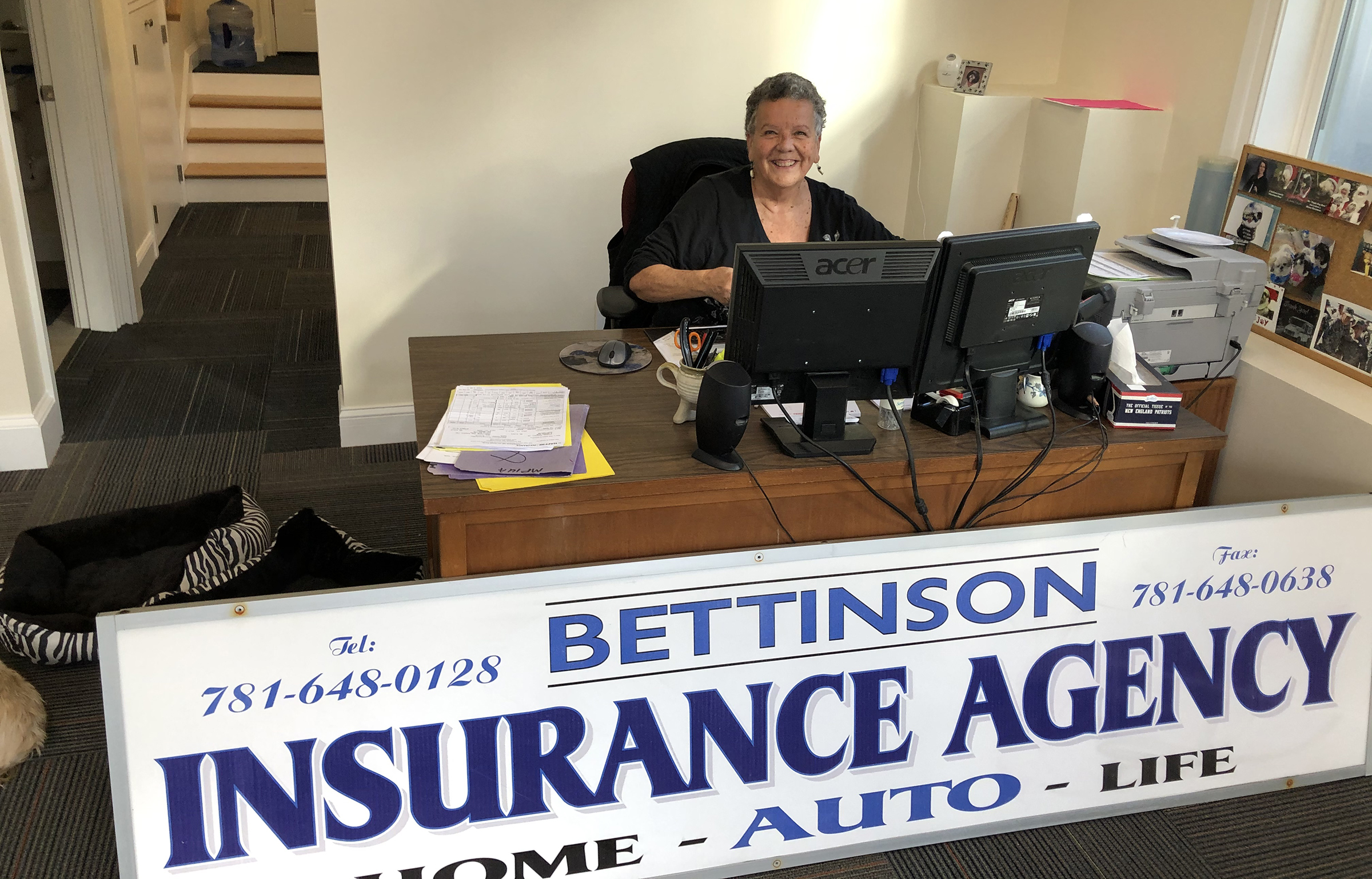 Female agent sitting at a desk in the office